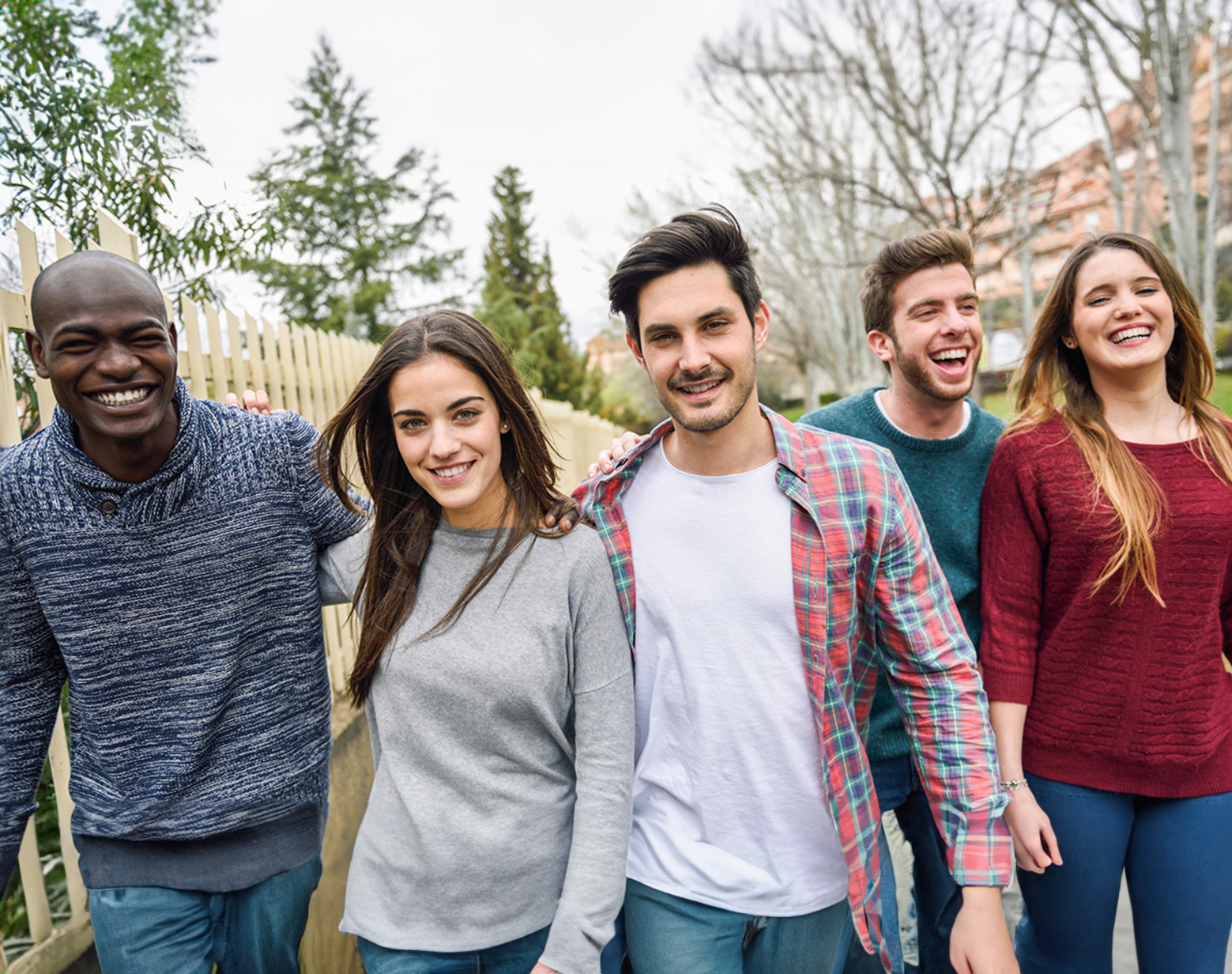 young adults of various backgrounds appearing happy